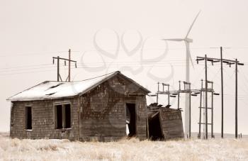 Windfarm and power lines near abandoned homestead