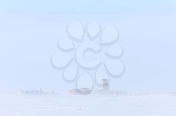 Town and Grain Elevator in Blizzard Saskatchewan 