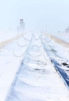 Train Tracks and Grain Elevator in Blizzard Saskatchewan 