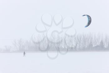 Parachute and Snow Boarding in Blizzard