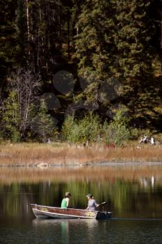 Two women boating on Ressor Lake in Alberta
