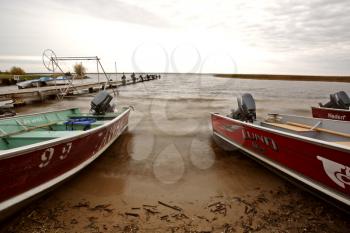 Motorboats beached at Waterhen Lake in Meadow Lake Park