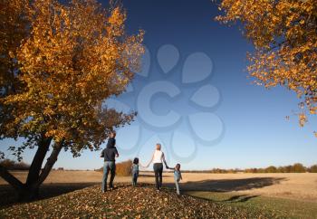 Family outside during a Saskatchewan autumn
