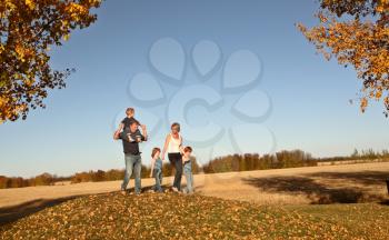 Family outside during a Saskatchewan autumn