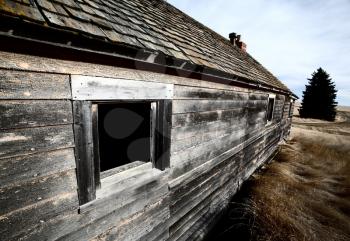 Wide angle view of abandoned farm house