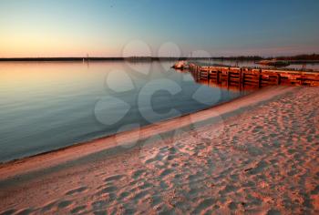 Beach and dock along shore of Lake Winnipeg