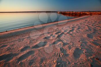 Beach and dock along shore of Lake Winnipeg