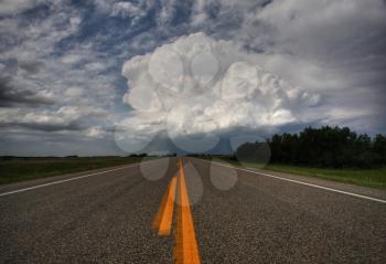 Storm clouds down a Saskatchewan highway