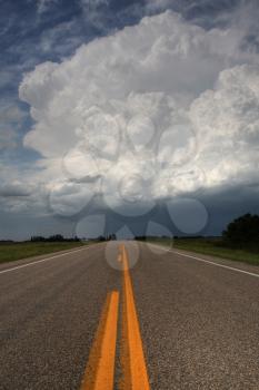 Storm clouds down a Saskatchewan highway