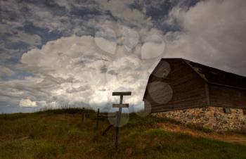 Storm clouds behind old Saskatchewan barn