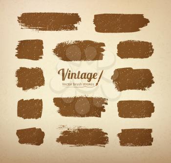 Collection of vector vintage brush strokes on grunge yellow paper texture.