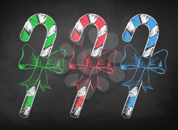 Collection of color chalkboard drawings of Christmas candy cane with bow.
