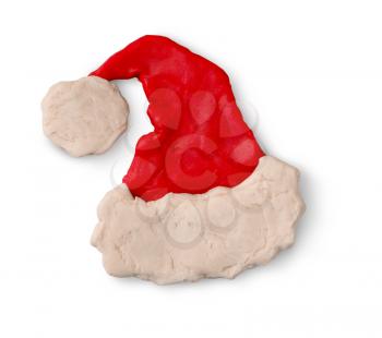 Hand made plasticine figure of Santa hat with shadow on white background.