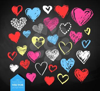 Vector color chalk drawn collection of grunge Valentine hearts on blackboard background.