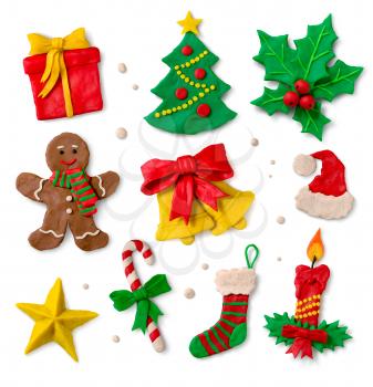 Hand made colored plasticine collection of Christmas symbols on white background.