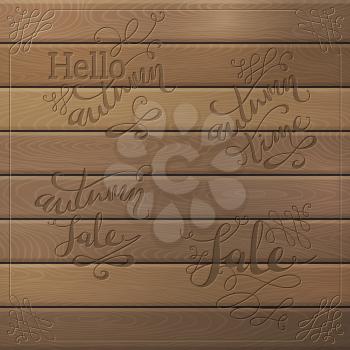 Hand-written words on wood background. Hello Autumn. Autumn Sale. Autumn Time. Sale.