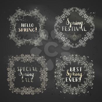 Hand-drawn linear flowers and leaves on tree branches. Seasonal lettering and flourishes. Blackboard background. There is copyspace for your text.
