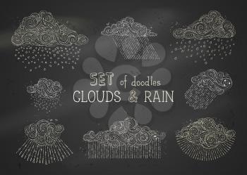 Ornate outlined clouds and rain drops on blackboard background. Hand-drawn doodles swirls, strokes, spirals and curls.