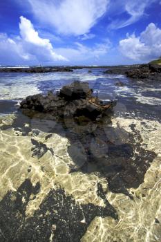 beach and rock in ile du cerfs mauritius