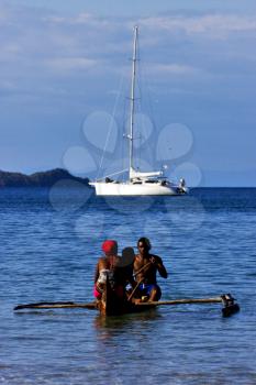  madagascar nosy be rock stone branch yacht boat palm lagoon and coastline
