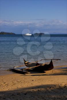  madagascar nosy be rock stone branch yacht boat palm lagoon and coastline