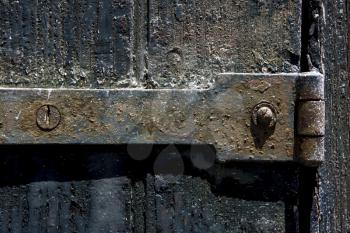 a old iron metal lock screw and wood in the centre of colonia del sacramento uruguay
