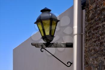 a street lamp and a water pipe in colonia del sacramento  uruguay