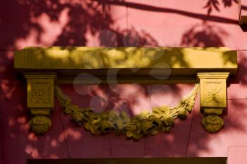 yellow marble top of door and a pink wall in la boca buenos aires argentina