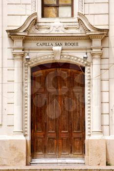brown wood old door of a church capilla san roque in the centre of buenos aires argentina 