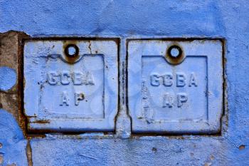 two metal box and a blue broken wall in la boca buenos aires argentina