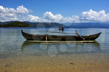 two man in a boat in madagascar for fishing and a boat free
