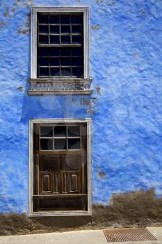 blue wood   couple of window in a paint wall arrecife lanzarote spain