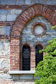  besnate cross church varese italy the old rose window   and mosaic wall in the sky sunny day 
bush