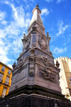 marble statue of obelisk immacolata  in the center of naples italy church 
