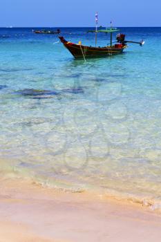 asia in the  kho tao bay isle white  beach    rocks house boat in thailand  and south china sea 
