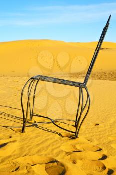 table and seat in  desert sahara morocco    africa yellow sand