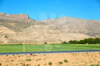in iran blur mountain and landscape from the window  of a car