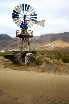 house in  isle of lanzarote  spain africa windmills and the sky 
