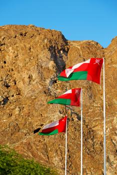 and the cloudy sky in oman waving flag mountain