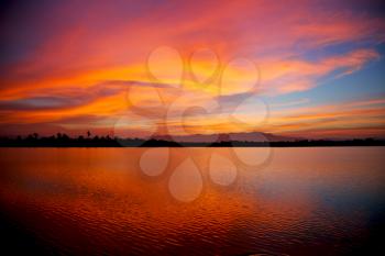  view from water  of the sunrise full of colors and rain concept of relax

