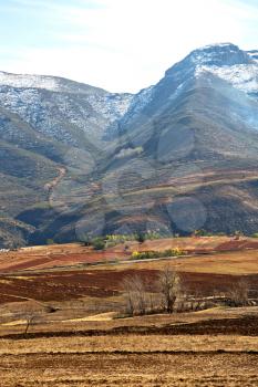 blur  in lesotho malealea street village near  mountain and coultivation field