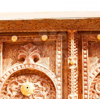 in oman antique door entrance and      decorative handle for background