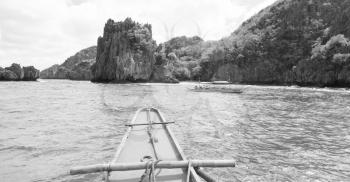 blur  in  philippines   view of the island hill from the prow of a boat
