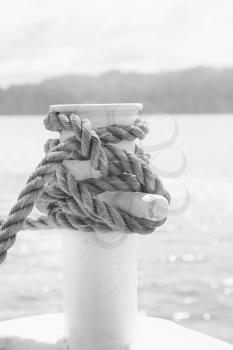 blur  in   philippines  a rope from an hammock near the ocean shore and cloud