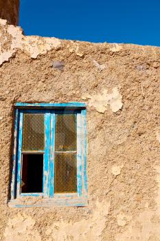 blue window in morocco africa old construction and brown wall  construction