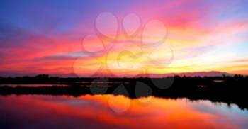 blur  view from water of the sunrise full of colors and rain concept of relax
