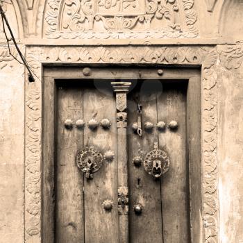 in iran old door near the mosque and antique construction