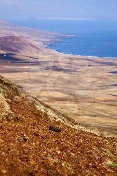 coastline lanzarote view from the top in  spain africa and house field 
