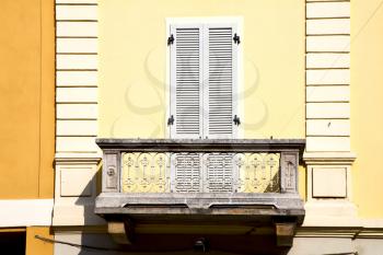 yellow  europe  italy  lombardy        in  the milano old   window closed brick      abstract grate  