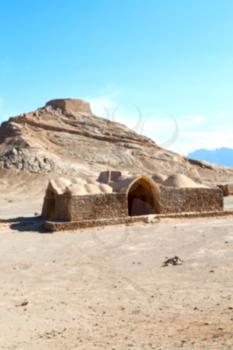 blur in iran near yazd the antique zoroastrian temple abandonated house and contruction